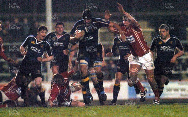 070106 - Llanelli Scarlets v Leinster - Celtic League -  Leinster's Adam Byrne tries to get past Dwayne Peel and Adam Jones