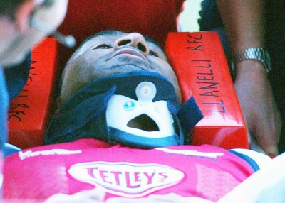 060903 - Llanelli Scarlets v Newport Gwent Dragons - Celtic League - Scarlets' Salesi Finau is stretchered off the field after a high tackle