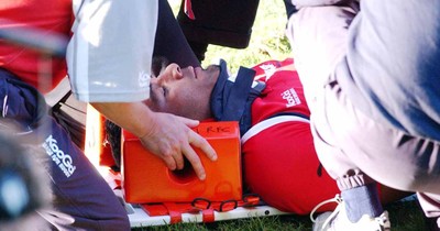 060903 - Llanelli Scarlets v Newport Gwent Dragons - Celtic League - Scarlets' Salesi Finau is stretchered off the field after sustaining a neck injury