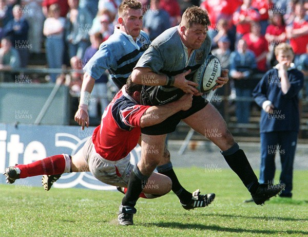 130497 - Llanelli v Cardiff - Jonathan Humphreys is tackled by Robin McBryde