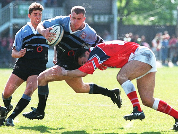 130497 - Llanelli v Cardiff - Leigh Davies is tackled by Frano Botica