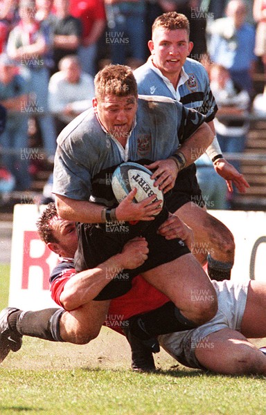 130497 - Llanelli v Cardiff - Jonathan Humphreys is tackled by Robin McBryde