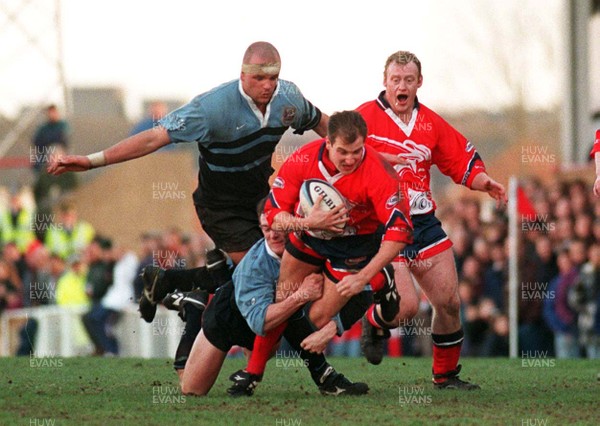 271297 - Llanelli v Cardiff -  Neil Boobyer is tackled by Rob Howley