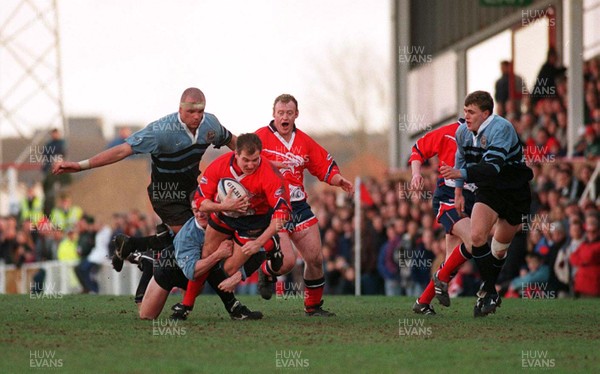 271297 - Llanelli v Cardiff -  Neil Boobyer of Llanelli is tackled by Rob Howley