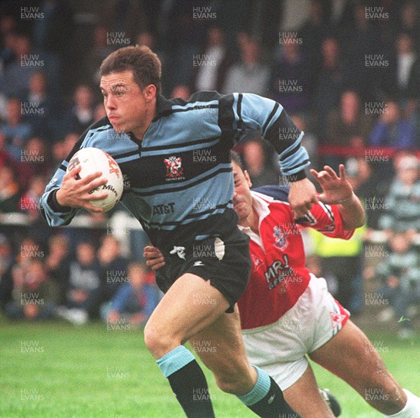 300995 - Llanelli v Cardiff - Simon Hill of Cardiff is tackled by Nigel Davies 