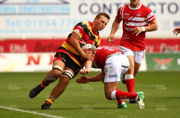 260817 - Llanelli RFC v Carmarthen Quins RFC - Principality Premiership - West Section - Sion Colella of Carmarthen Quins is tackled by Ioan Hughes of Llanelli 