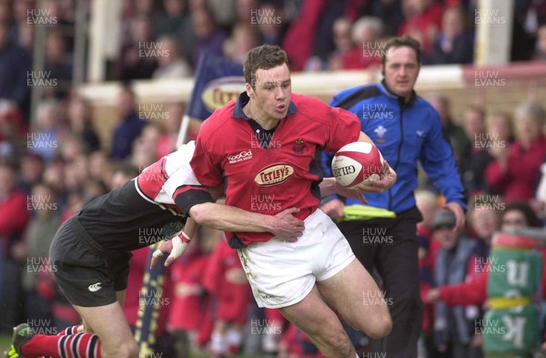 210401 - Llanelli v Edinburgh Reivers - Welsh-Scottish League - Llanelli's Mark Jones is tackled by Cammy Murray