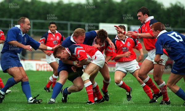 121096 - Llanelli v Leinster - Garan Evans of Llanelli is tackled by Victor Costello