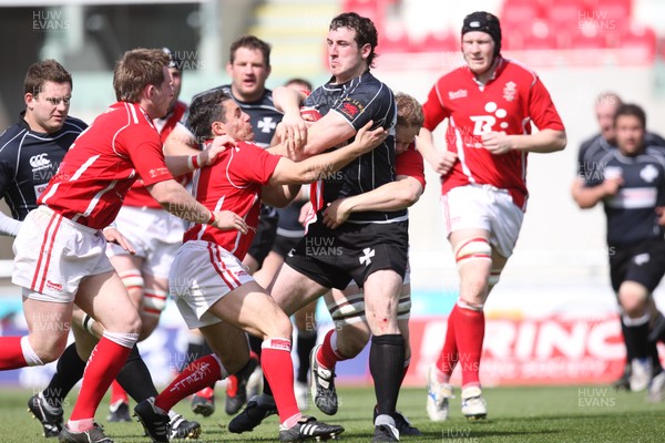 02.05.09 - Llanelli v Neath, Principality Premiership -  Neath's Dafydd Lockyear is tackled by Llanelli's Gareth Davies and Luke Jones 