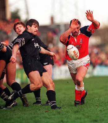 251195 - Llanelli v Neath - Paul Morris of Llanelli is charged down by Chris Bridges