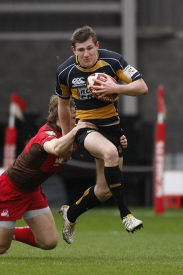 03.04.10 Llanelli RFC v Newport RFC - Principality Premiership - Newport's Alan Awcock is caught by Llanelli's Nick Reynolds. 