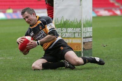 03.04.10 Llanelli RFC v Newport RFC - Principality Premiership - Newport's Gareth Wyatt slides in under the posts to score a try. 