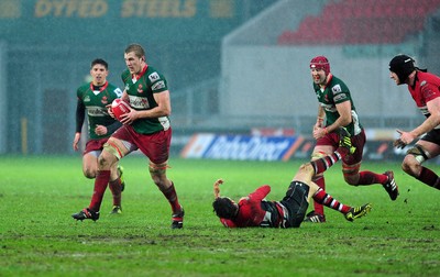 04.02.12. Llanelli RFC v Pontypool RFC, Principality Premiership..Llanelli's Craig Price charges through the Pontypool defence..