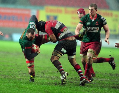 04.02.12. Llanelli RFC v Pontypool RFC, Principality Premiership..Llanelli's Allan Powell is brought down..