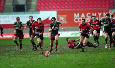 04.02.12. Llanelli RFC v Pontypool RFC, Principality Premiership..Pontypool's Tom Hanccock (left) and Llanelli's Nic Reynolds chase down the ball..