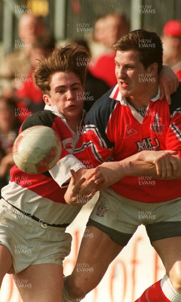 220397 - Llanelli v Pontypool - Neil Boobyer of Llanelli is tackled by Stuart Lawrence