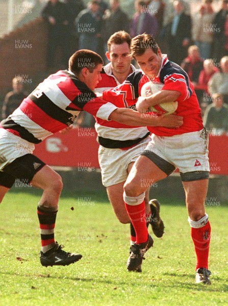 220397 - Llanelli v Pontypool - Neil Boobyer is tackled by Lennie Woodard