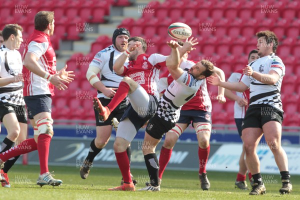 220315 - Llanelli RFC v Pontypridd RFC - Principality Premiership -Llanelli's Shaun Leonard and Pontypridd's Simon Humberstone challenge for a high ball