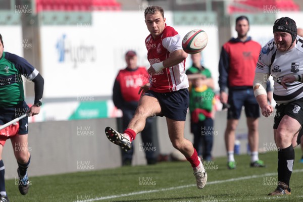 220315 - Llanelli RFC v Pontypridd RFC - Principality Premiership -Llanelli's Sam Evans kicks ahead