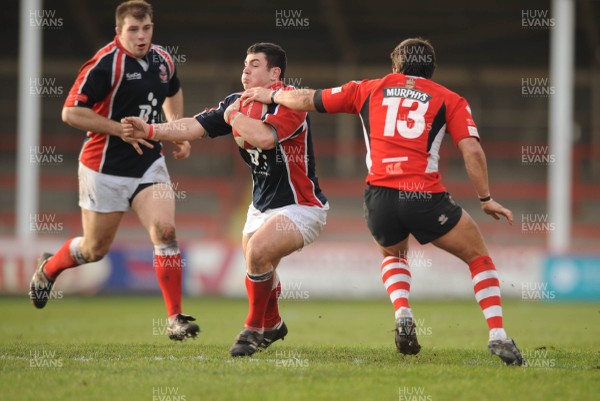 26.01.08 - Llanelli v Pontypridd - Konica Minolta Cup - Llanelli's Andrew Banfield is tackled by Gavin Dacey 