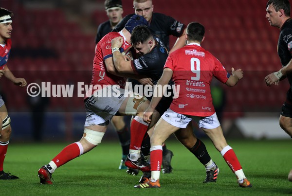 030122 - Llanelli RFC v RGC - Indigo Premiership - Rhodri King of RGC is tackled by Chris Long of Llanelli