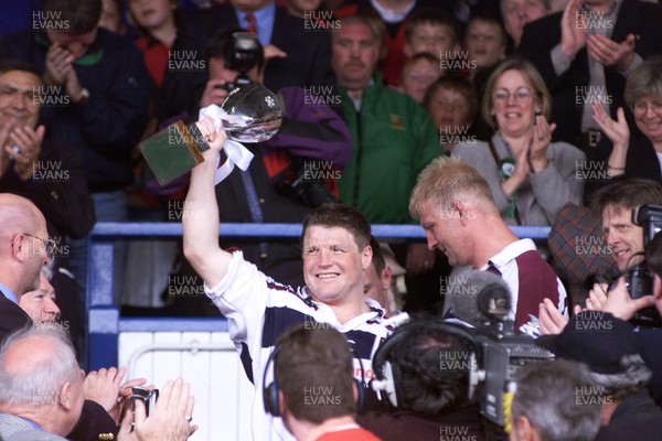 150599 - Llanelli v Swansea - SWALEC Cup Final -  Swansea captain Scott Gibbs celebrates with the trophy