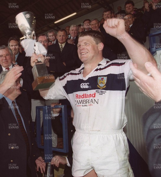 150599 - Llanelli v Swansea - SWALEC Cup Final -  Swansea captain Scott Gibbs celebrates with the trophy