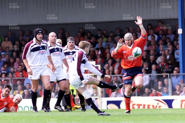 150599 - Llanelli v Swansea - SWALEC Cup Final -  Swansea's Arwel Thomas scores a drop goal despite charge down attempt by Ian Boobyer