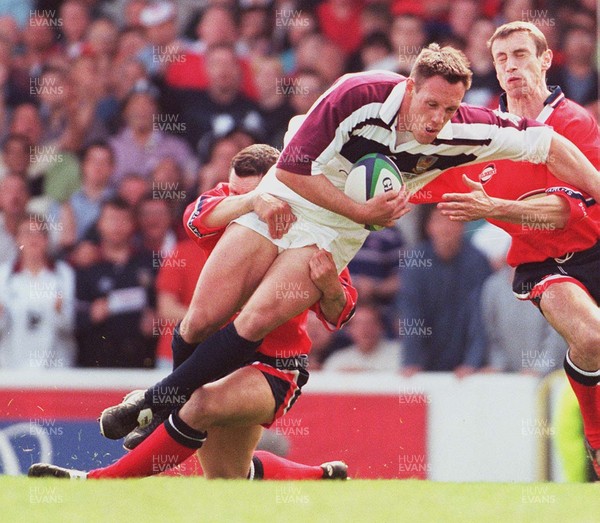 150599 - Llanelli v Swansea - SWALEC Cup Final -  Swansea's  Mark Taylor is tackled short of the line by Byron Haywood