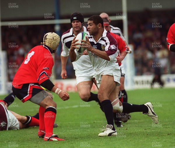 150599 - Llanelli v Swansea - SWALEC Cup Final -  Swansea's Colin Charvis takes on Llanelli's  Rupert Moon