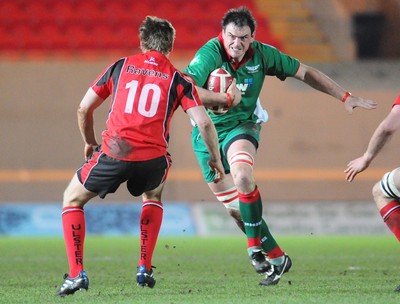 12.02.10 - British and Irish Cup rugby, Llanelli RFC v Ulster A Llanelli's Vernon Cooper runs at Ulster's Niall O'Connor 