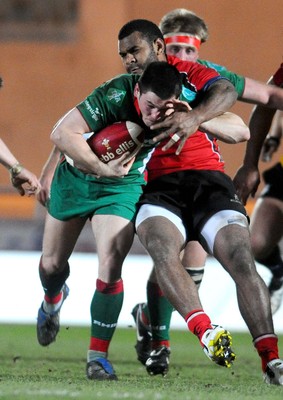 12.02.10 - British and Irish Cup rugby, Llanelli RFC v Ulster A Llanelli's Dan Newton is tackled by Timoci Nagusa 