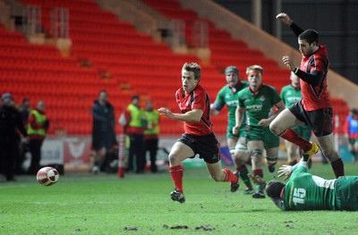 12.02.10 - British and Irish Cup rugby, Llanelli RFC v Ulster A Ulster's Paul Marshall kicks through on his way to score a try 