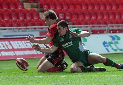 12.02.10 - British and Irish Cup rugby, Llanelli RFC v Ulster A Ulster's Paul Marshall beats Llanelli's Dan Newton to the ball to score a try 