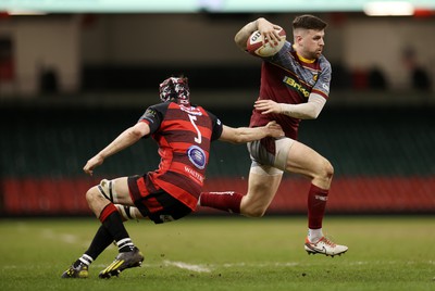 070424 - Llaneilli Wanderers v Glynneath - Division One Cup Final - Lewis Jones of Llanelli Wanderers is tackled by Arwel Davies of Glynneath 