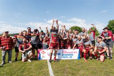 100525 - Llanelli Wanderers v Gorseinon - Admiral Championship West - Llanelli Wanderers captain Rhodri Owens celebrates with his team