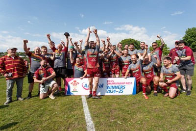 100525 - Llanelli Wanderers v Gorseinon - Admiral Championship West - Llanelli Wanderers captain Rhodri Owens celebrates with his team