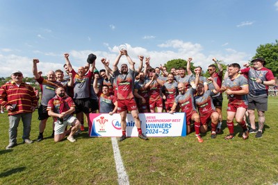 100525 - Llanelli Wanderers v Gorseinon - Admiral Championship West - Llanelli Wanderers captain Rhodri Owens celebrates with his team