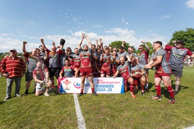 100525 - Llanelli Wanderers v Gorseinon - Admiral Championship West - Llanelli Wanderers captain Rhodri Owens celebrates with his team