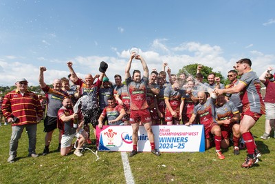 100525 - Llanelli Wanderers v Gorseinon - Admiral Championship West - Llanelli Wanderers captain Rhodri Owens celebrates with his team