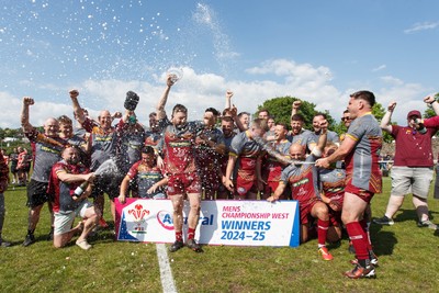 100525 - Llanelli Wanderers v Gorseinon - Admiral Championship West - Llanelli Wanderers captain Rhodri Owens celebrates with his team