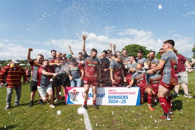 100525 - Llanelli Wanderers v Gorseinon - Admiral Championship West - Llanelli Wanderers captain Rhodri Owens celebrates with his team