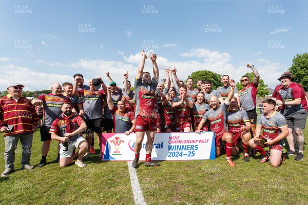 100525 - Llanelli Wanderers v Gorseinon - Admiral Championship West - Llanelli Wanderers captain Rhodri Owens celebrates with his team