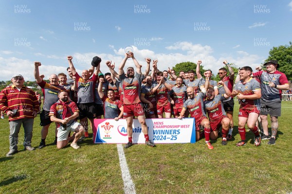 100525 - Llanelli Wanderers v Gorseinon - Admiral Championship West - Llanelli Wanderers captain Rhodri Owens celebrates with his team