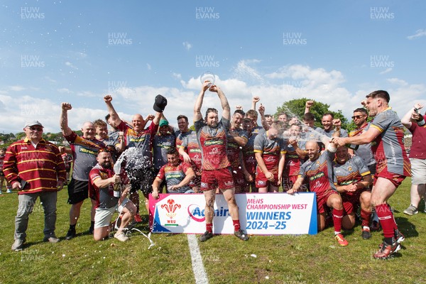 100525 - Llanelli Wanderers v Gorseinon - Admiral Championship West - Llanelli Wanderers captain Rhodri Owens celebrates with his team