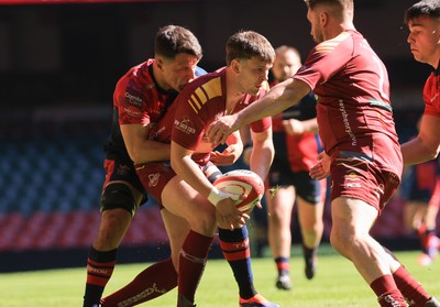 050425  Llanelli Wanderers v Tondu, WRU Championship Cup Final - Jac Hart of Llanelli Wanderers is head by Ben Davies of Tondu