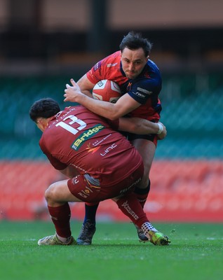 050425  Llanelli Wanderers v Tondu, WRU Championship Cup Final - Stu Young of Tondu takes on Rhydian Morgan of Llanelli Wanderers
