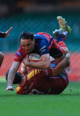 050425  Llanelli Wanderers v Tondu, WRU Championship Cup Final - Stu Young of Tondu takes on Rhydian Morgan of Llanelli Wanderers