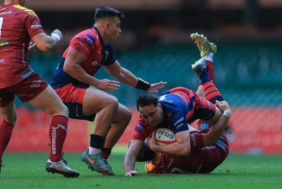 050425  Llanelli Wanderers v Tondu, WRU Championship Cup Final - Stu Young of Tondu takes on Rhydian Morgan of Llanelli Wanderers