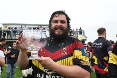 020526 - Llangadog v Cefneithin - Admiral National League 4 West B - Llangadog veteran Telor Dyer celebrates with the trophy at his final game for the Club
